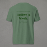 Light green Ghosts T-shirt back against a grey concrete wall