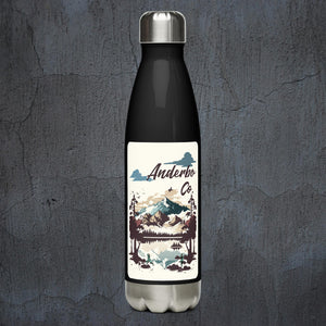 Black stainless steel water bottle.  Large white vertical rectangle with a picture of a lake in front of mountains with ninjas on the shore.